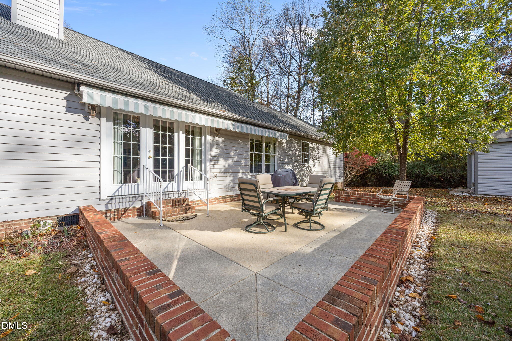 69 Deer Run Court Angier, NC 27501 - Photo 34 of 40 a view of a patio with couches table and chairs and potted plants