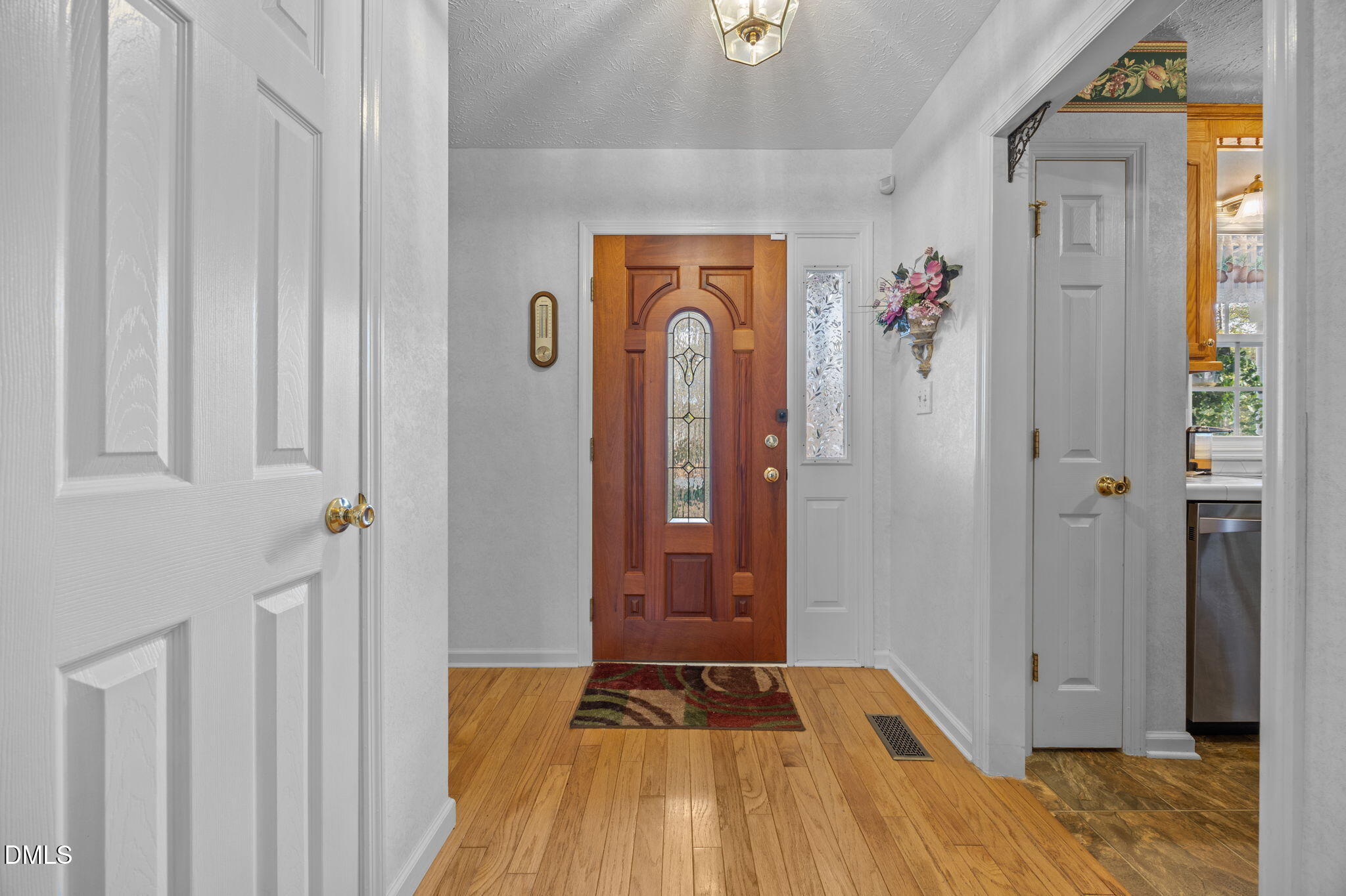 69 Deer Run Court Angier, NC 27501 - Photo 3 of 40 a view of a hallway view with wooden floor and closet
