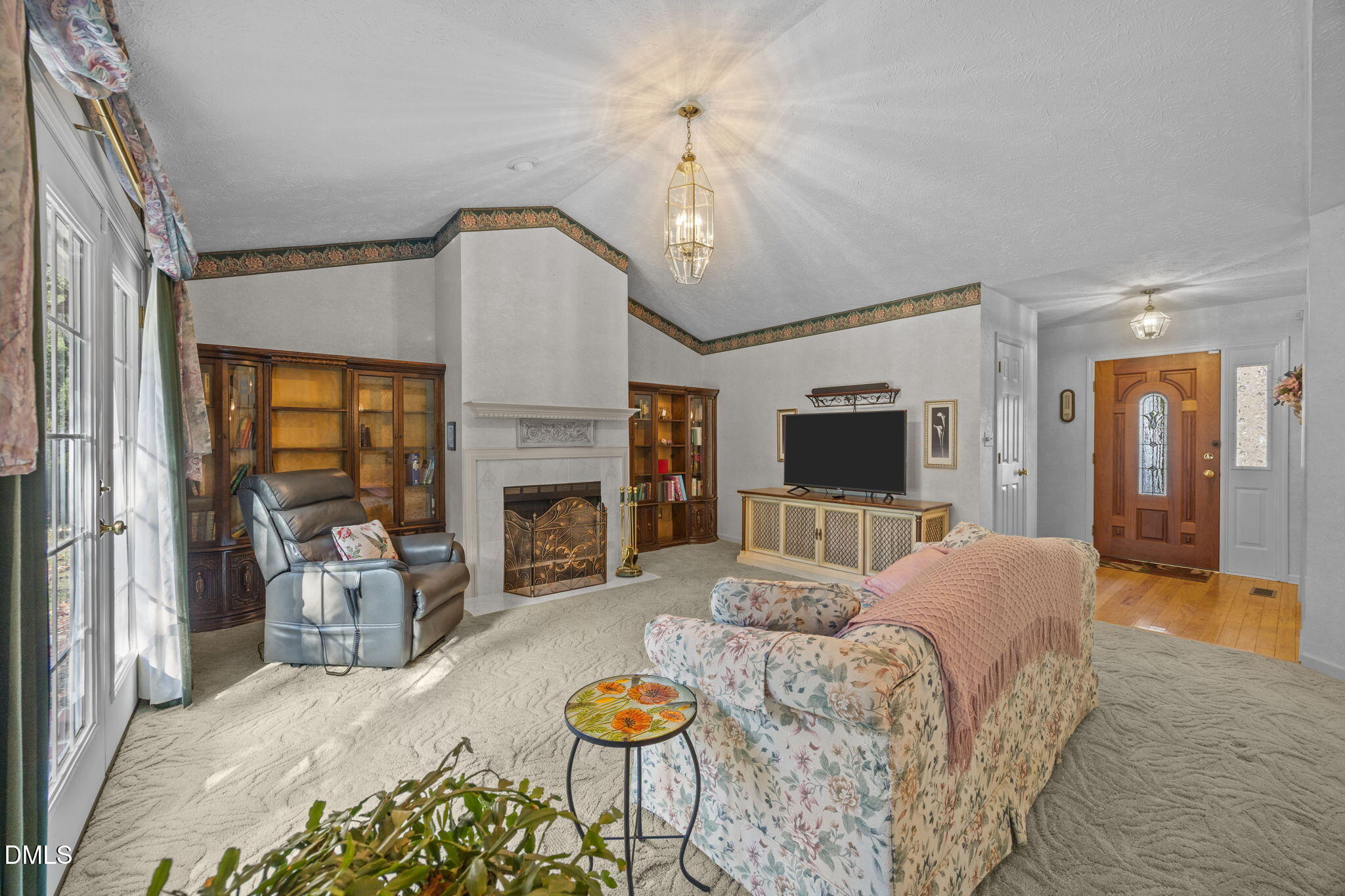69 Deer Run Court Angier, NC 27501 - Photo 6 of 40 a living room with furniture fireplace and a flat screen tv