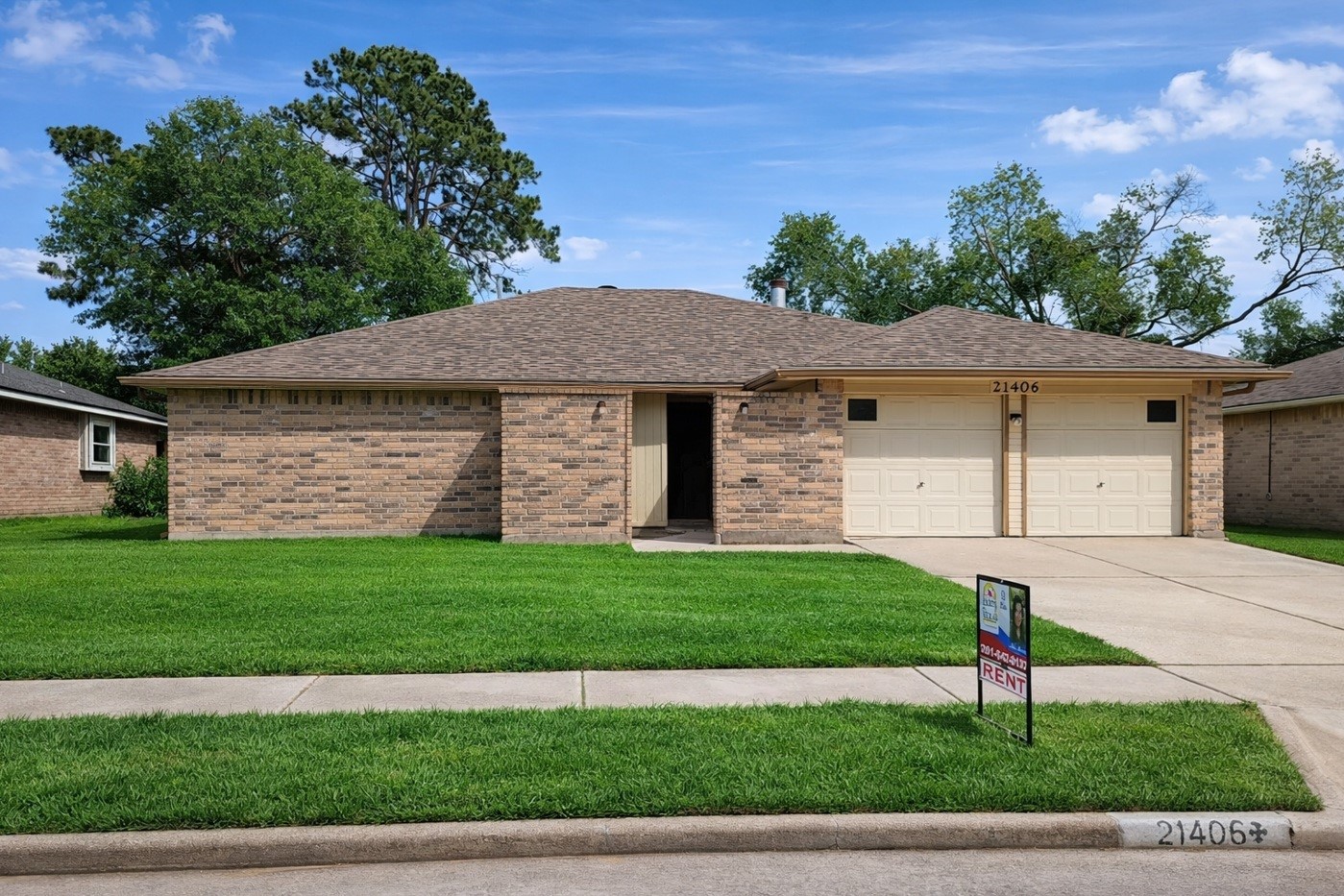 21406 Golden Dove Drive Spring, TX 77388 - Photo 1 of 29 a front view of a house with a garden