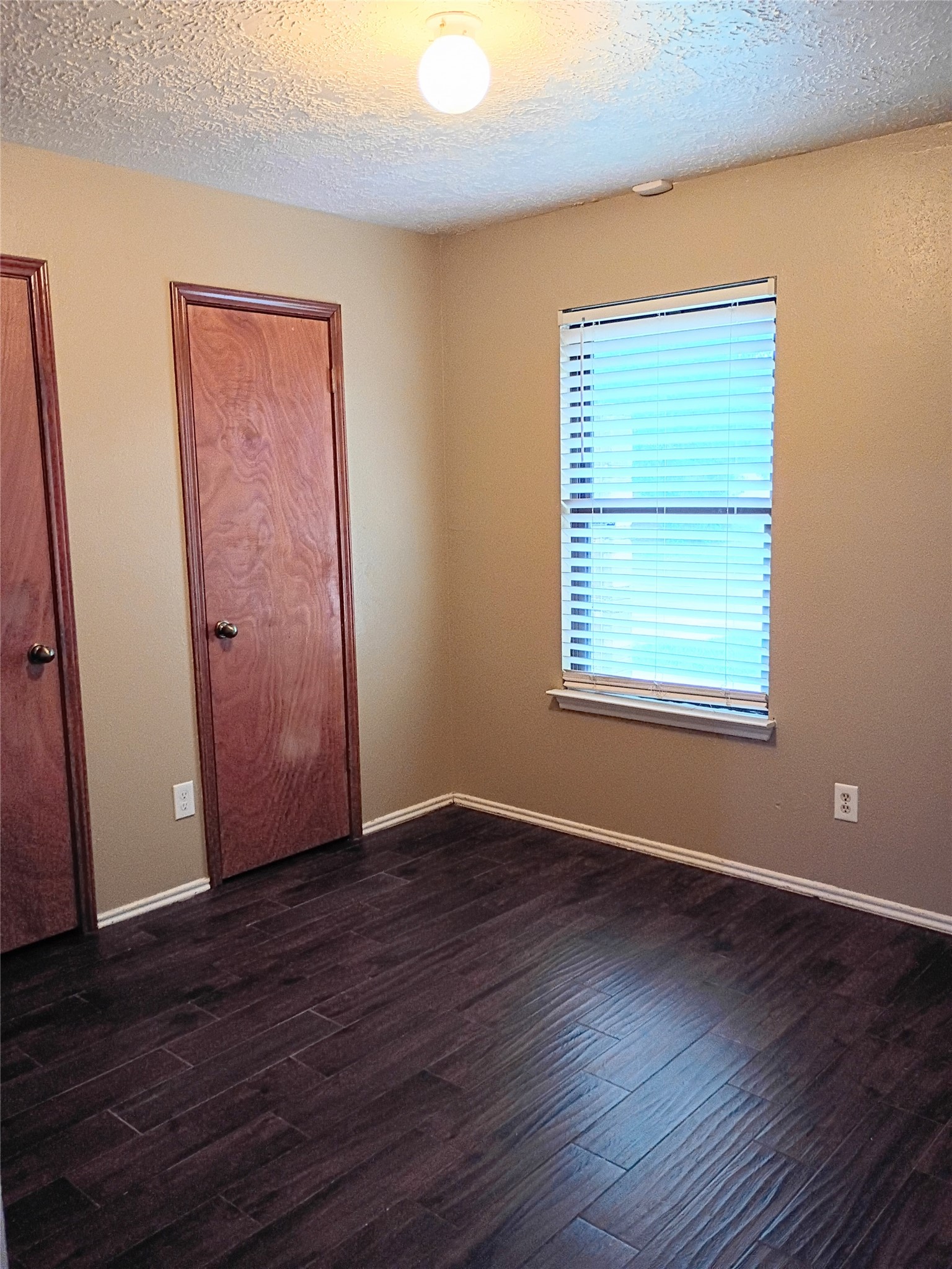 21406 Golden Dove Drive Spring, TX 77388 - Photo 26 of 29 a view of an empty room with wooden floor and a window