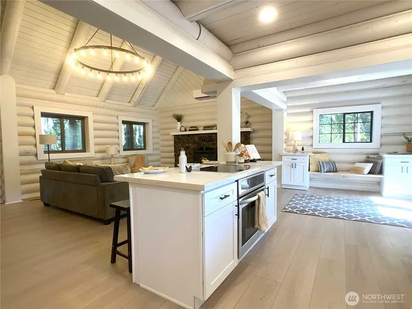 a kitchen with a stove a sink and a refrigerator