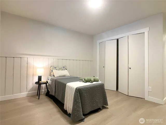 a bedroom with a bed and closet