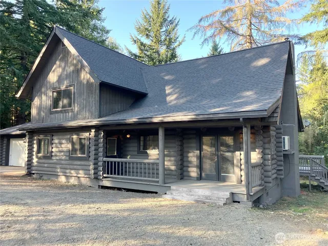a view of a house with wooden fence