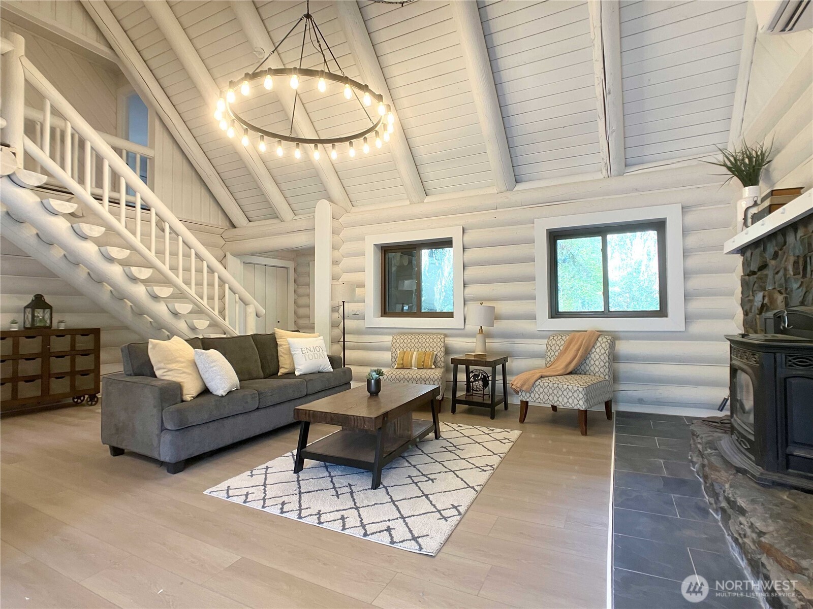 193 Crego Ridge Road Chehalis, WA 98532 - Photo 7 of 31 a living room with furniture a fireplace and a chandelier