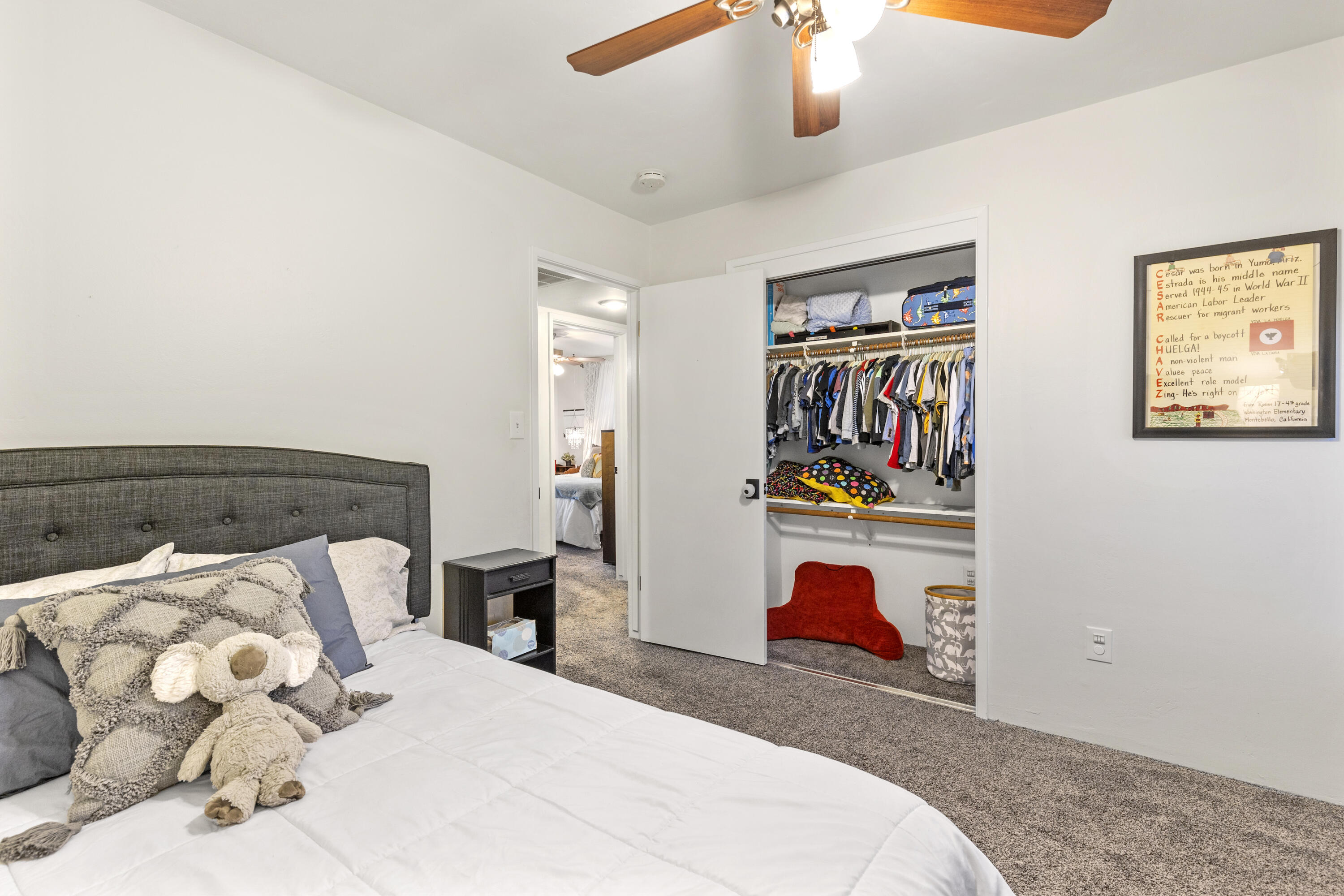20727 Ridgecrest Drive Tehachapi, CA 93561 - Photo 23 of 27 a bedroom with bed and cupboard