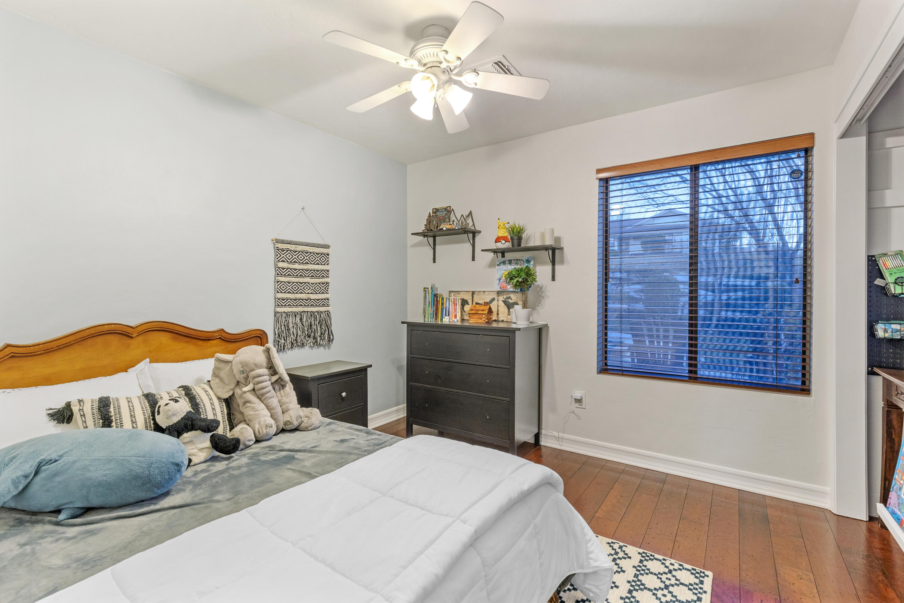 20727 Ridgecrest Drive Tehachapi, CA 93561 - Photo 24 of 27 a bedroom with a bed dresser and a window