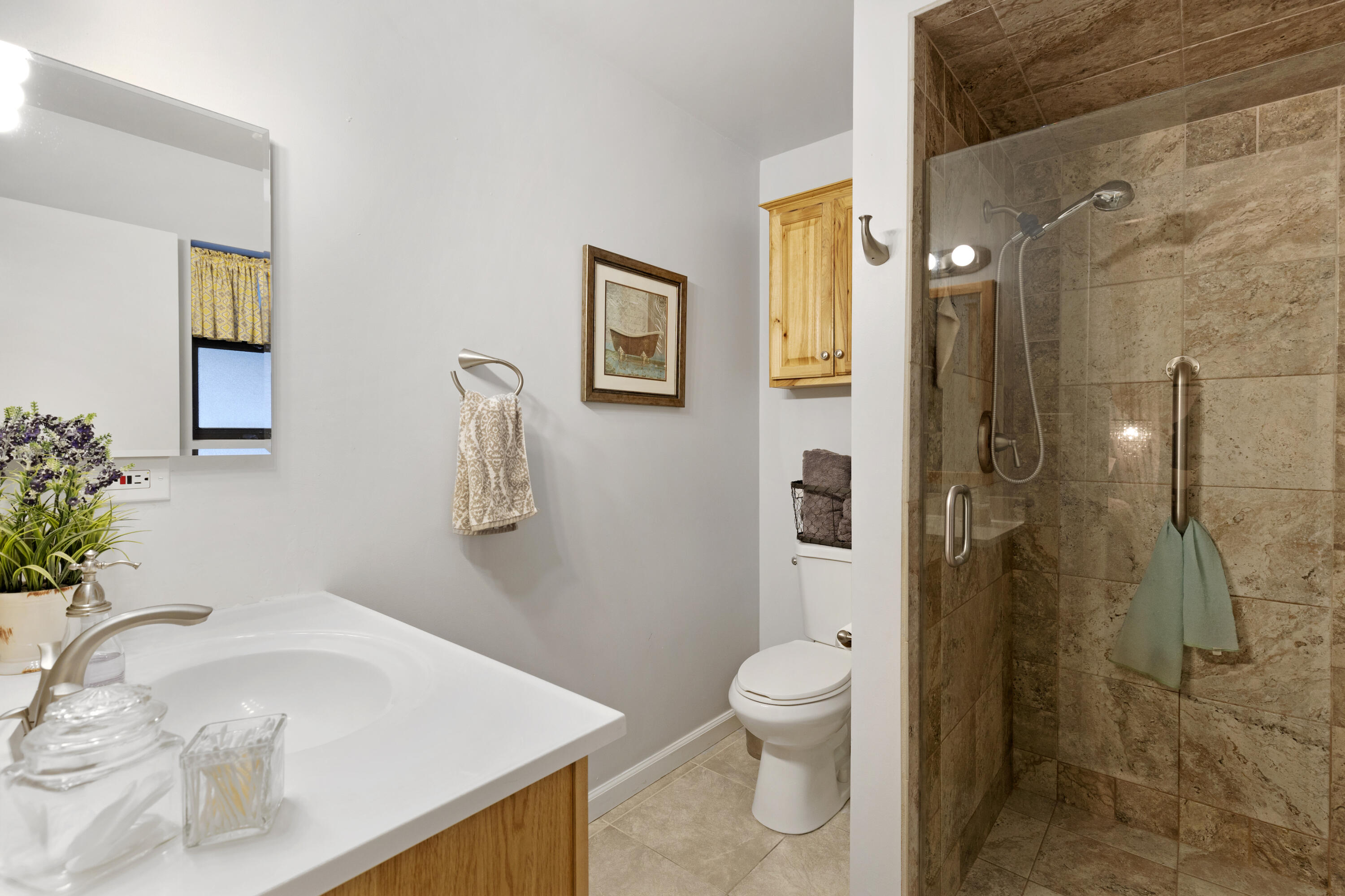 20727 Ridgecrest Drive Tehachapi, CA 93561 - Photo 27 of 27 a bathroom with a sink a toilet and shower