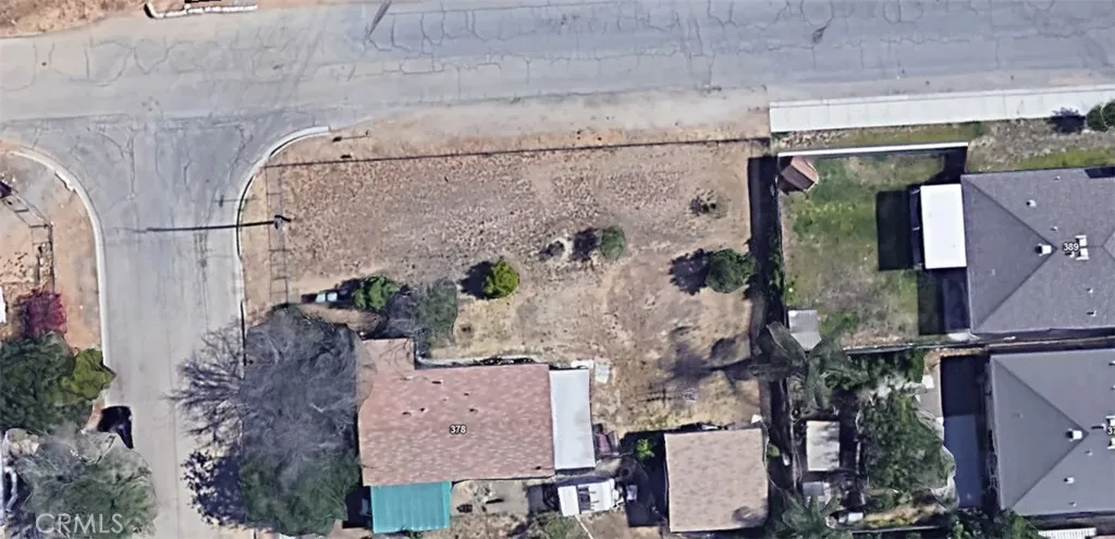 an aerial view of houses with outdoor space