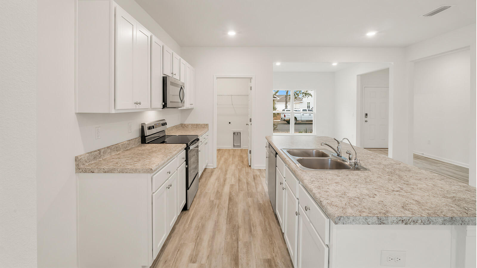 38 Elderberry Street Freeport, FL 32439 - Photo 11 of 34 a kitchen with stainless steel appliances granite countertop a sink stove and refrigerator
