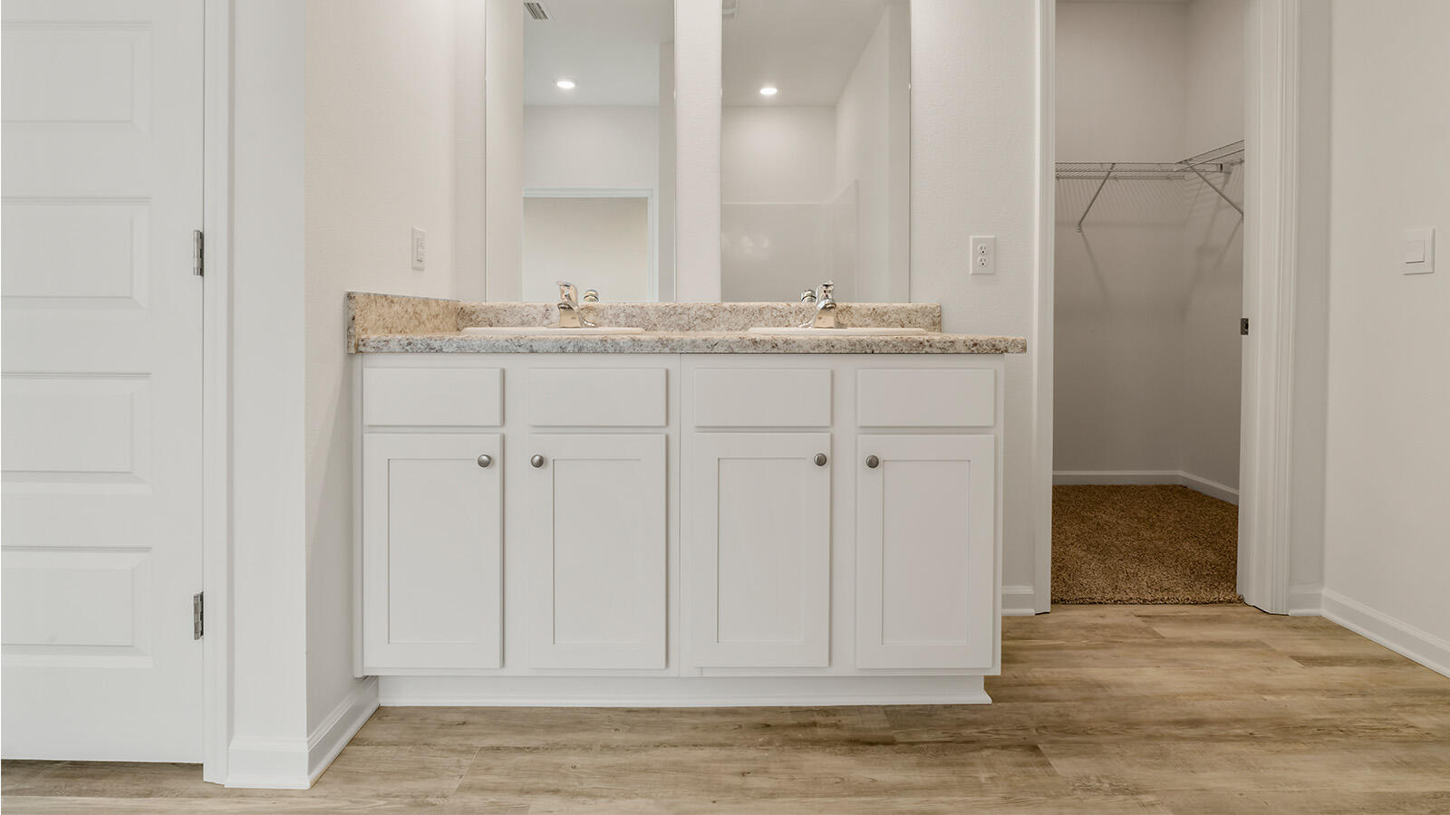 38 Elderberry Street Freeport, FL 32439 - Photo 16 of 34 a bathroom with a granite countertop sink and a mirror