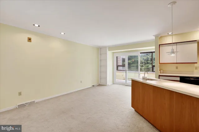 a large kitchen with a large window