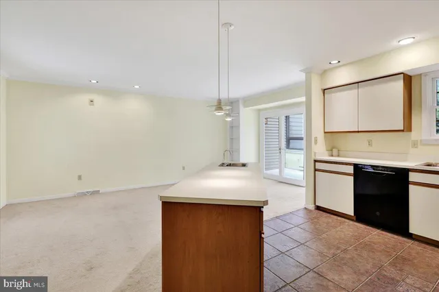 a kitchen with a stove a sink and a refrigerator