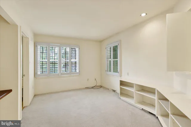 a view of a hallway with a kitchen