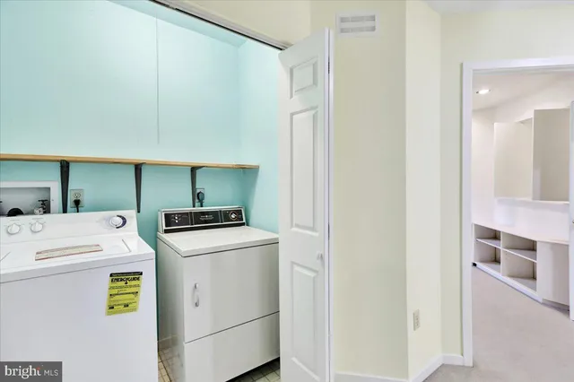 a view of a house with a backyard and plants