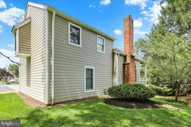 a view of a house with a yard and plants