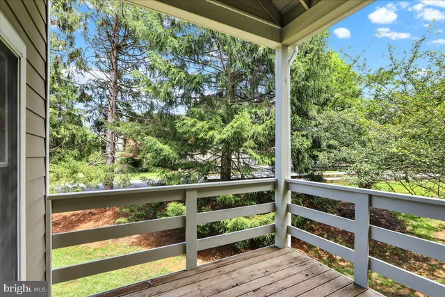 a front view of a house with a yard and porch