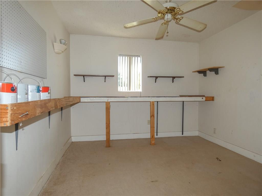 2079 Southeast Triumph Road Port St. Lucie, FL 34952 - Photo 16 of 23 wooden floor in an empty room with a window