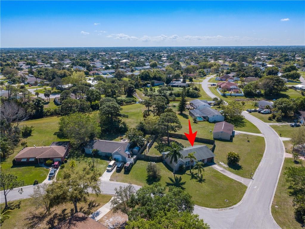 2079 Southeast Triumph Road Port St. Lucie, FL 34952 - Photo 6 of 23 an aerial view of residential houses with outdoor space and ocean view