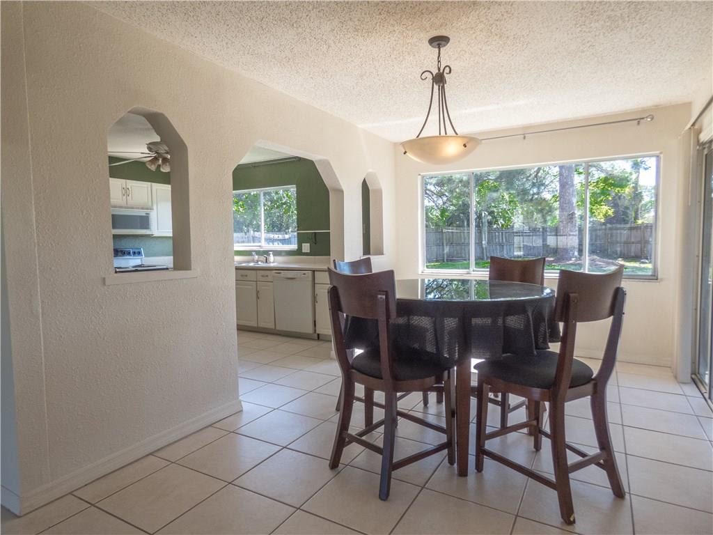 2079 Southeast Triumph Road Port St. Lucie, FL 34952 - Photo 10 of 23 a dining room with furniture window and outside view