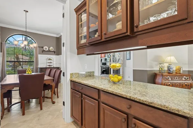 a large kitchen with a stove and a sink