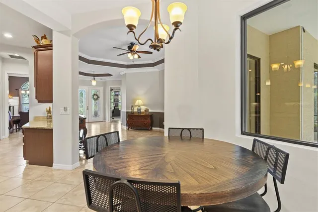 a living room with furniture a flat screen tv and a large window