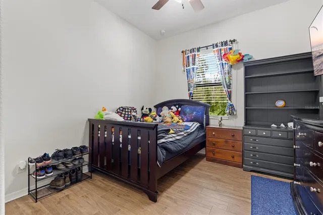 a bathroom with a granite countertop sink a light fixture and a mirror