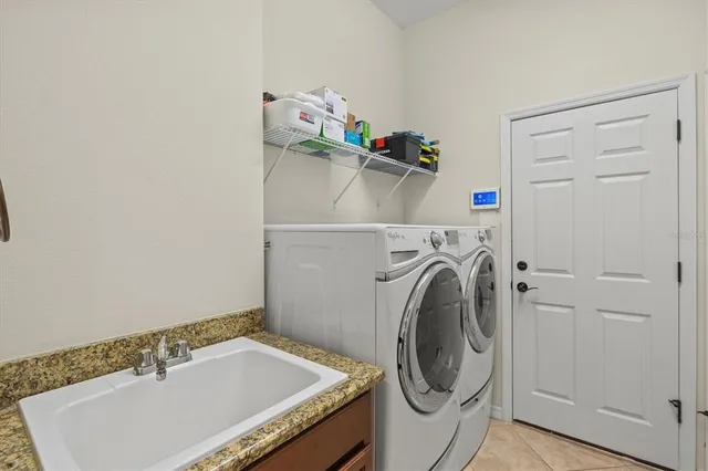 a view of an outdoor dining room with furniture window and outside view