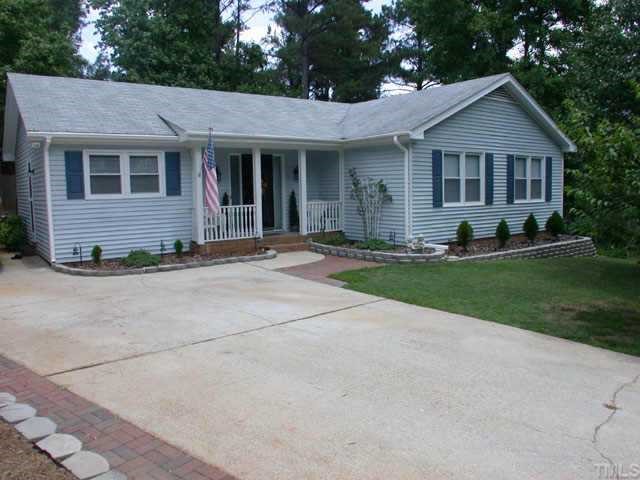 7204 Bluffside Court Raleigh, NC 27615 - Photo 1 of 1 a front view of a house with a yard and trees