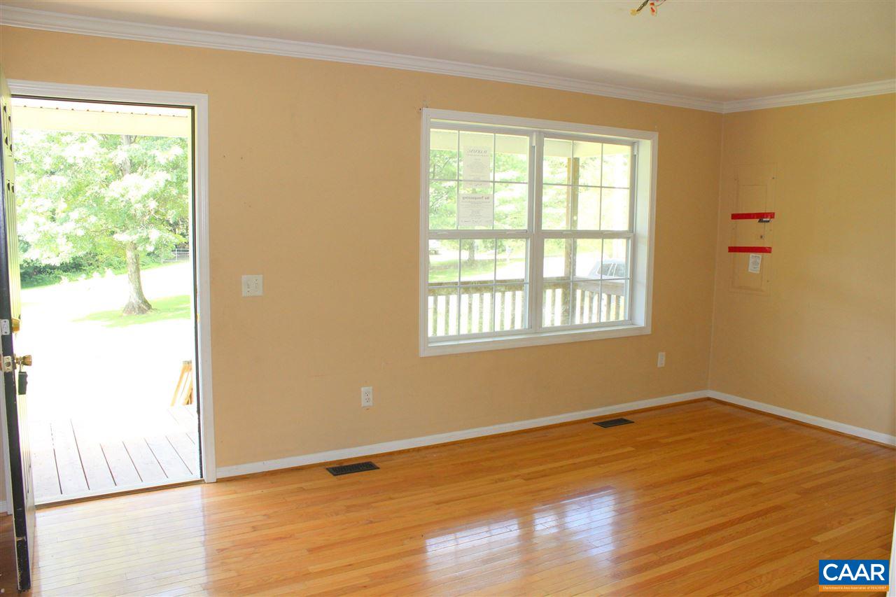 322 Chapel Road Ruckersville, VA 22968 - Photo 4 of 15 a view of an empty room with wooden floor and a window