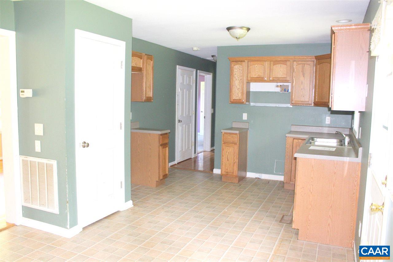 322 Chapel Road Ruckersville, VA 22968 - Photo 5 of 15 a view of hallway with furniture and a refrigerator