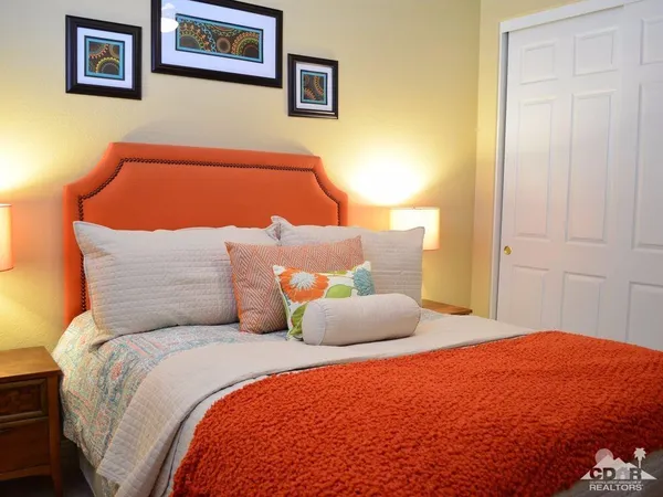 a bedroom with bed and a window