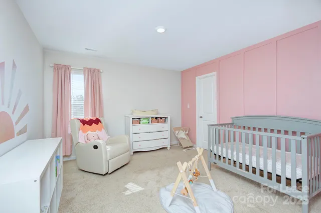 a bedroom with furniture and a window