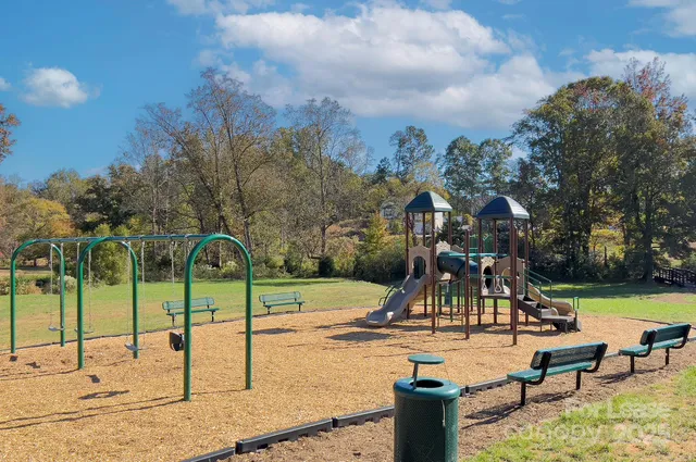 a view of a park with swings