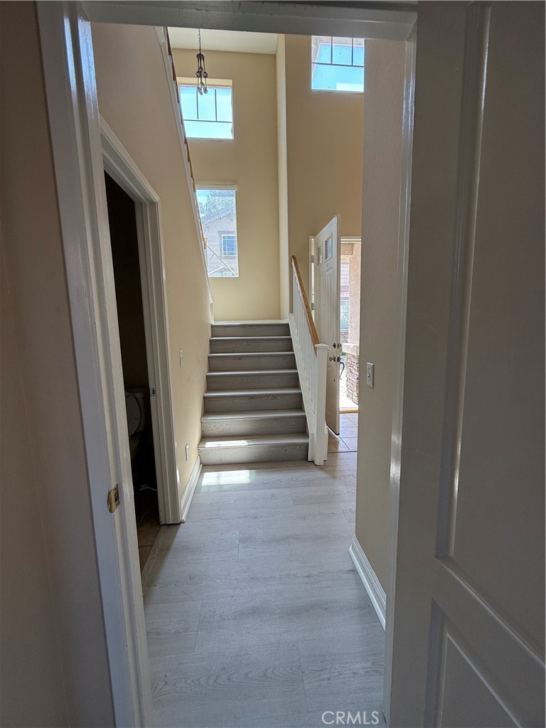 4318-4318 Walnut Street, Unit A Baldwin Park, CA 91706 - Photo 7 of 16 a view of a hallway with wooden floor and entryway