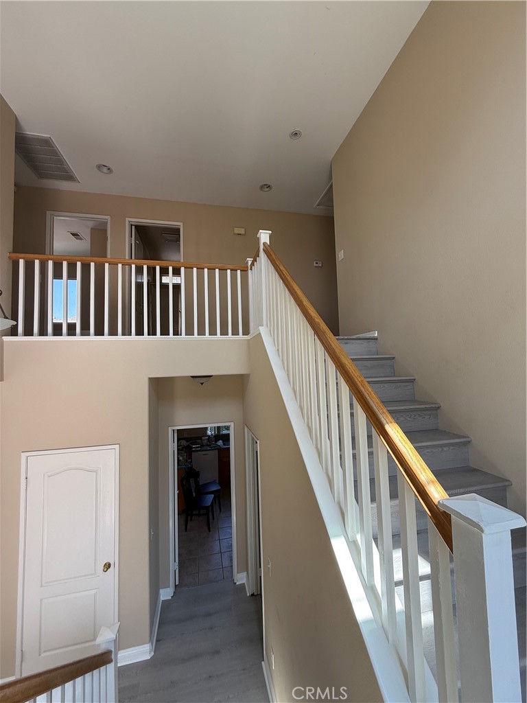 4318-4318 Walnut Street, Unit A Baldwin Park, CA 91706 - Photo 8 of 16 a view of staircase with white walls and a window