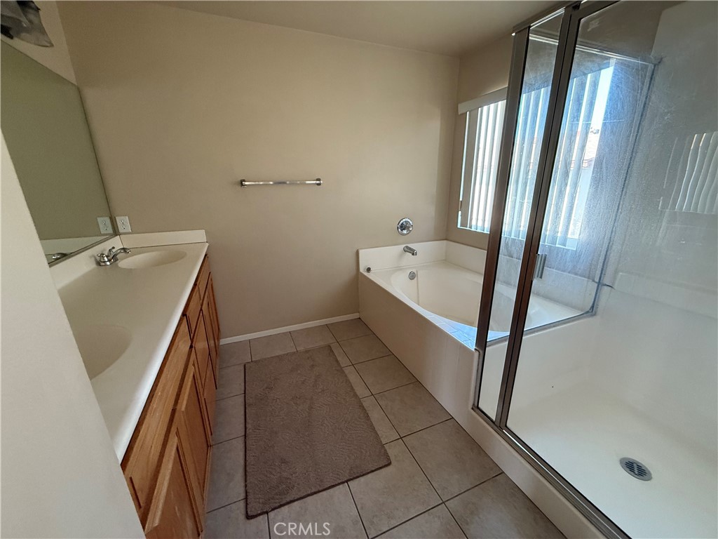 4318-4318 Walnut Street, Unit A Baldwin Park, CA 91706 - Photo 10 of 16 a bathroom with a tub sink and mirror