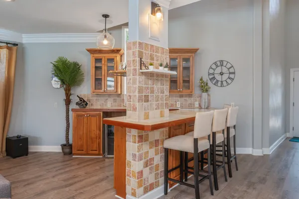 a kitchen with stainless steel appliances granite countertop a refrigerator and a stove top oven