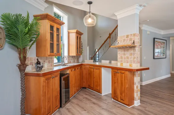 a kitchen with stainless steel appliances granite countertop a stove and a sink