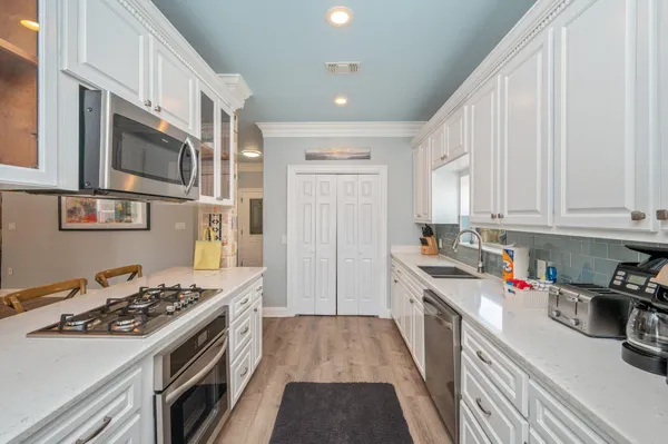 a bathroom with a toilet a sink and shower