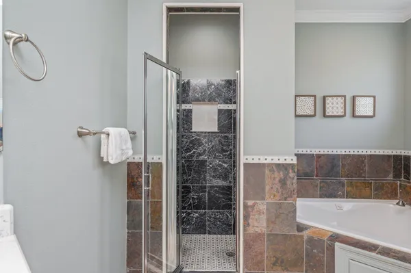 a view of a house with swimming pool and sitting area