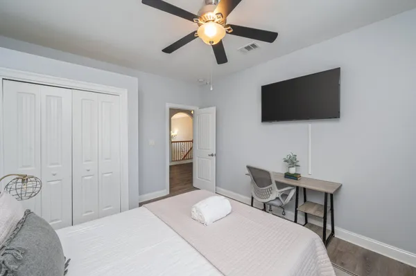 a view of a house with swimming pool and sitting area