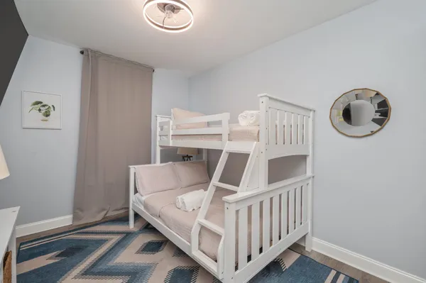 an aerial view of residential houses with outdoor space and parking