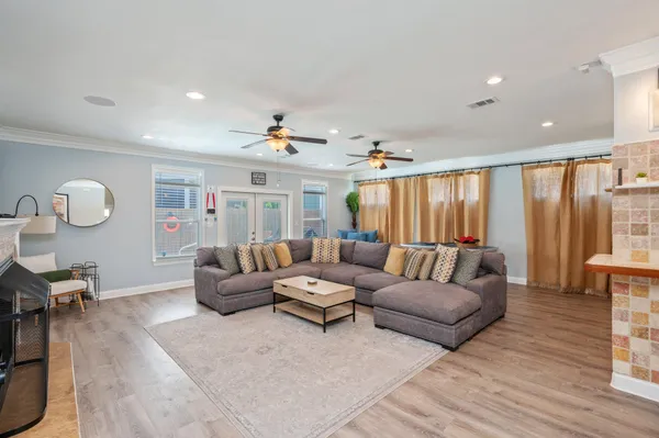 a living room with furniture and a flat screen tv