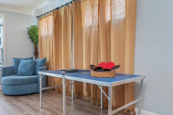 a dining room with furniture and window