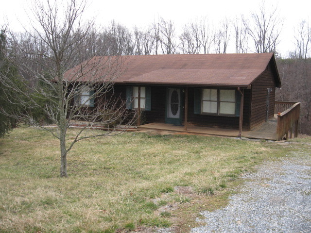 1753 Sandy Level Road Goodview, VA 24095 - Photo 1 of 3 a front view of a house with a yard