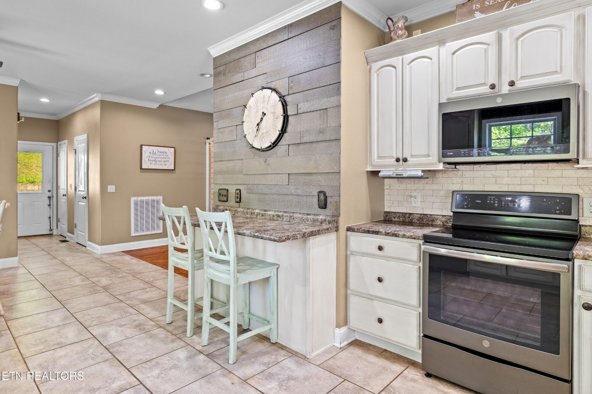 349 Rudd Hollow Road Townsend, TN 37882 - Photo 19 of 52 a kitchen with stainless steel appliances granite countertop a stove and cabinets
