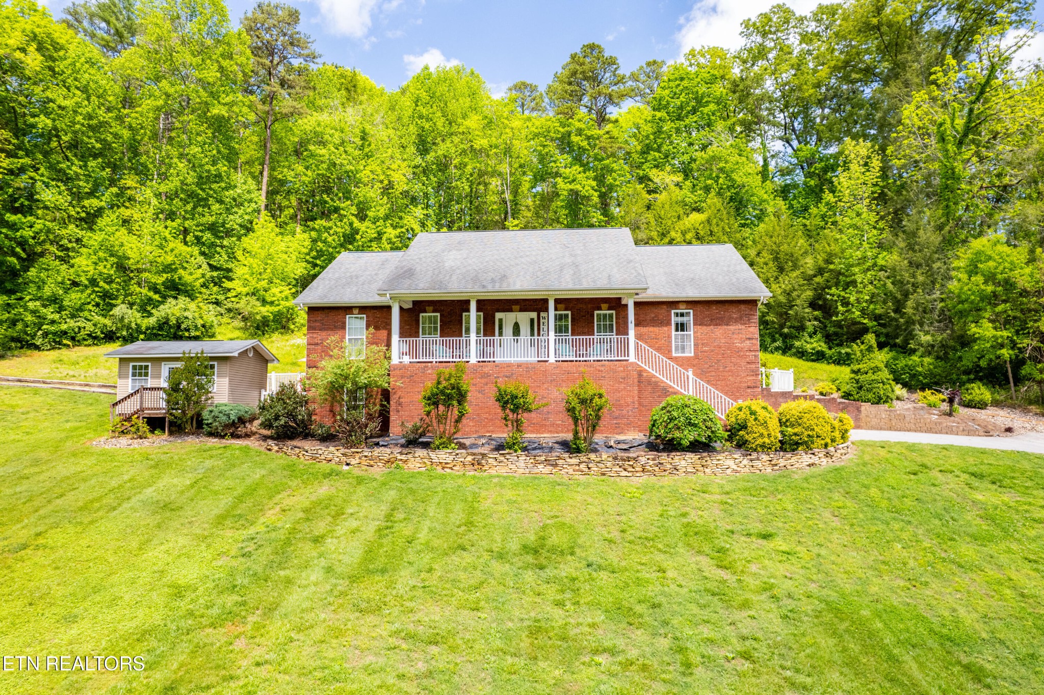 349 Rudd Hollow Road Townsend, TN 37882 - Photo 2 of 52 a front view of a house with a yard