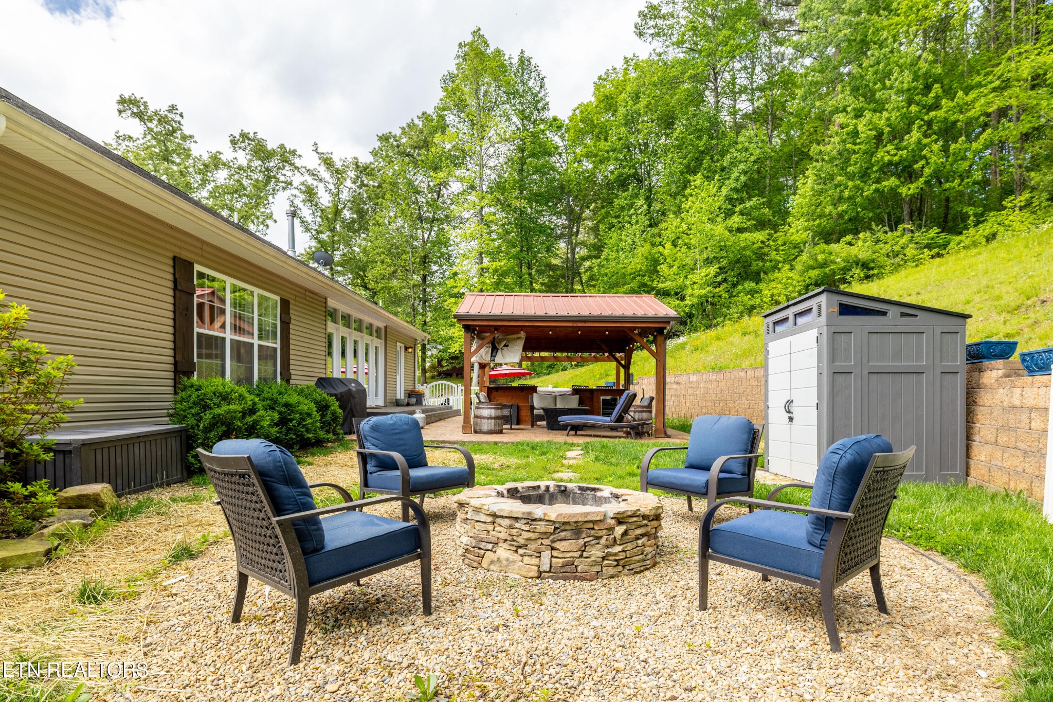 349 Rudd Hollow Road Townsend, TN 37882 - Photo 28 of 52 a view of a house with a backyard and sitting area