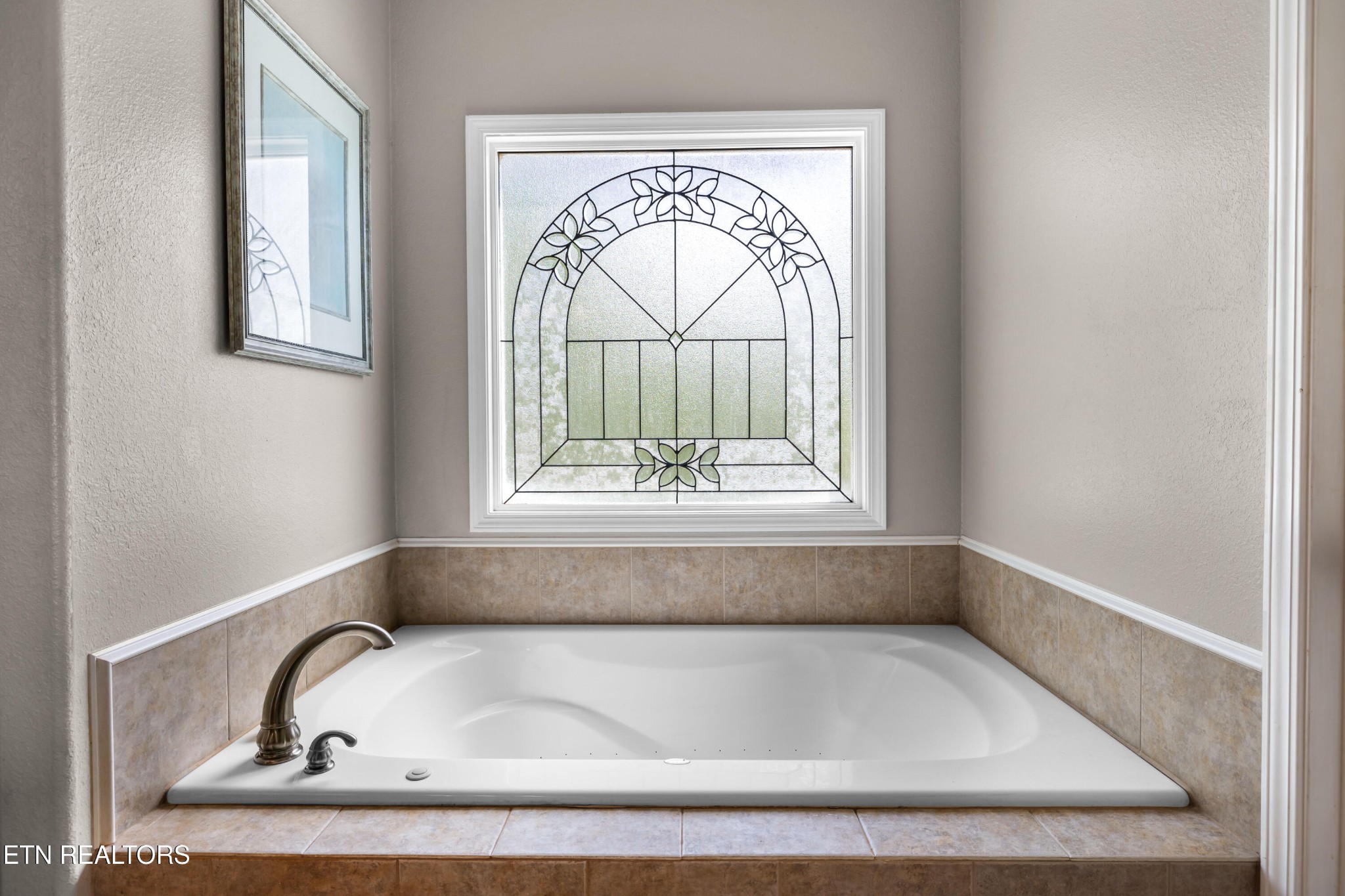 349 Rudd Hollow Road Townsend, TN 37882 - Photo 32 of 52 a bathroom with a bathtub and a window